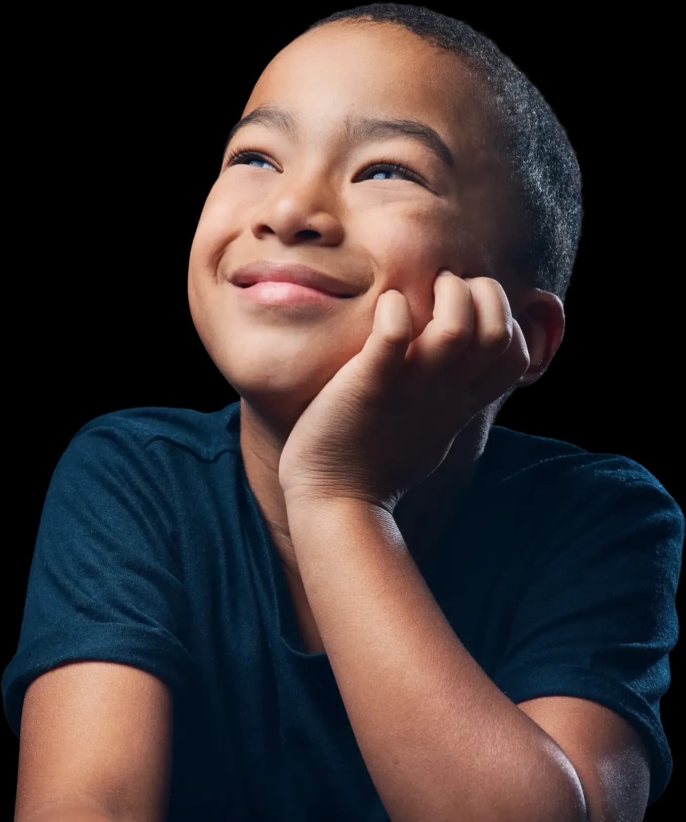 Smiling boy resting his chin on his hand