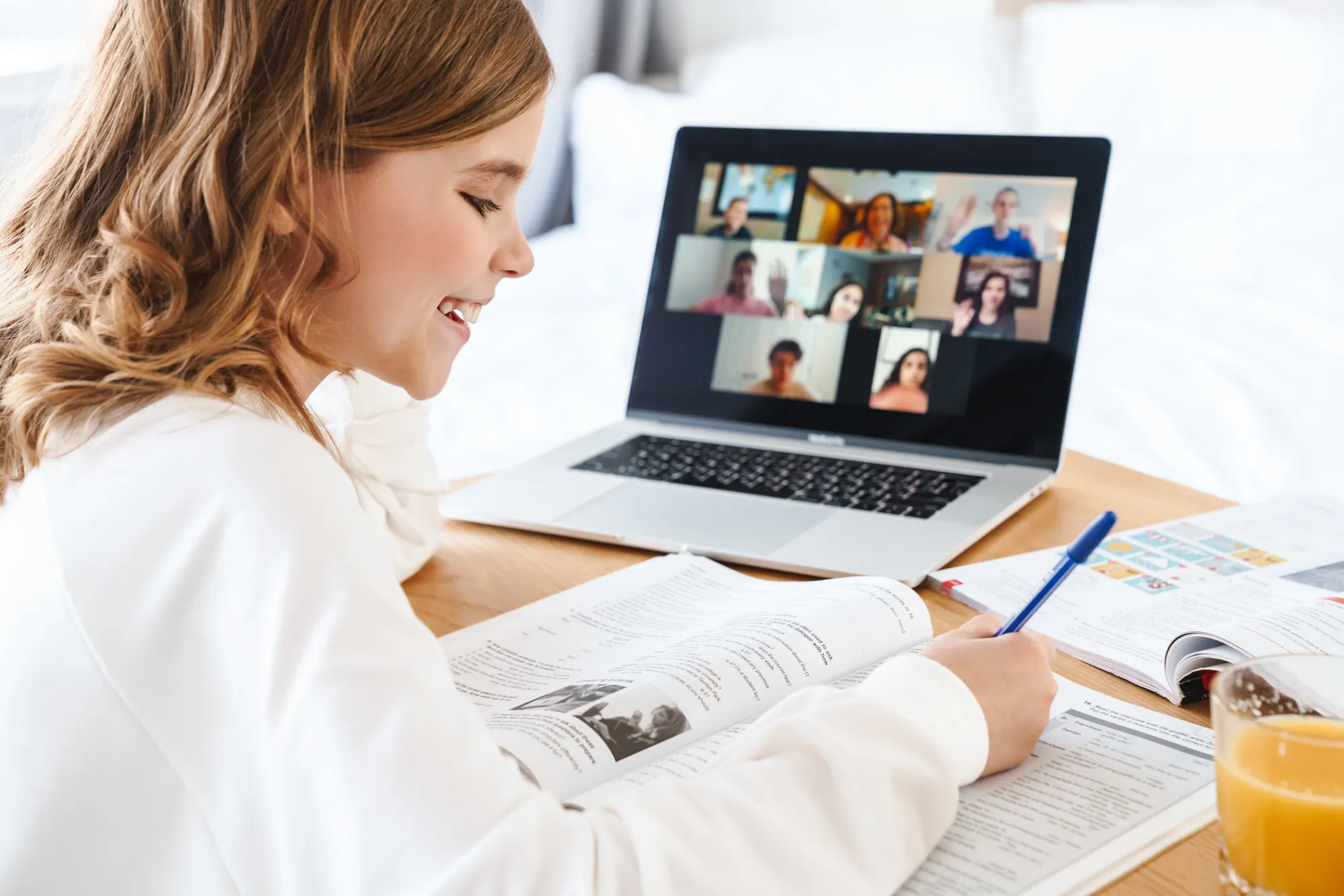 Girl taking part in an online lesson on her laptop
