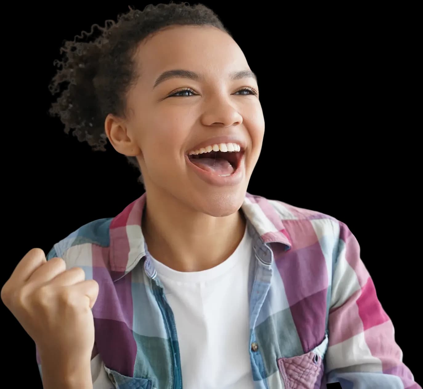 Teenage girl in a checked shirt laughing and celebrating
