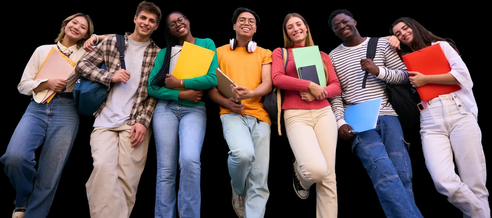 Group of students holding folders and leaning together, smiling