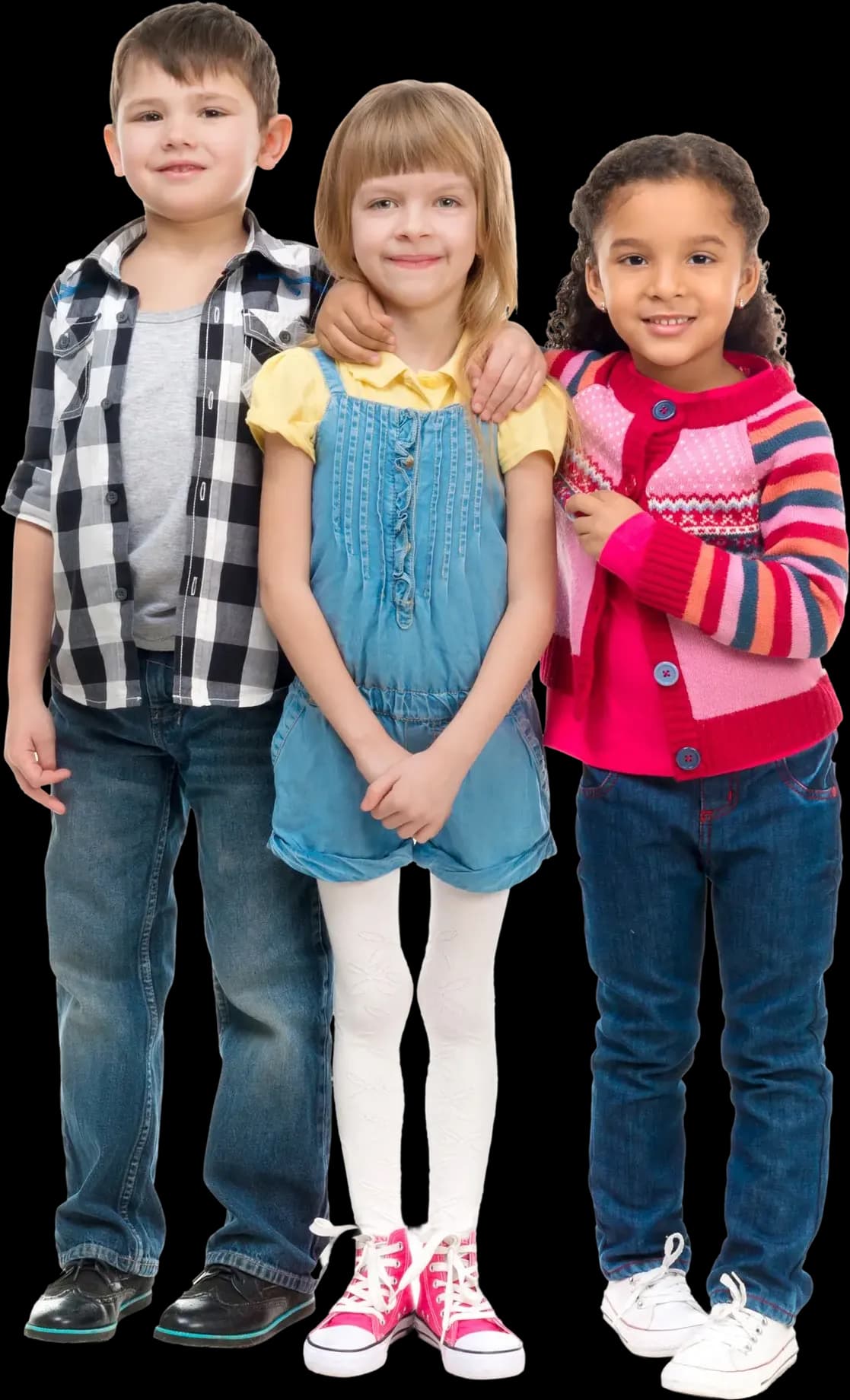Three young children standing together and smiling